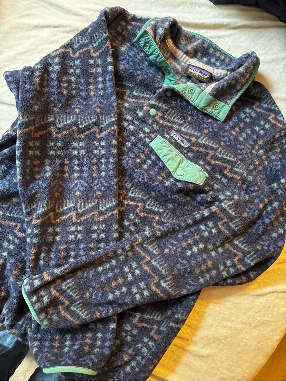 Patagonia women’s Navy Geometric Fleece Pullover with Mint Trim